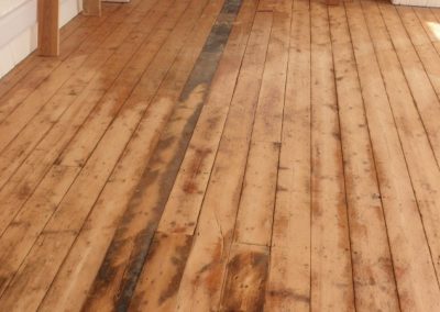 Damaged 7" T&G boards were replaced with reclaimed Victorian timber planks in long lengths